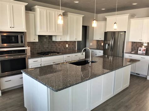 white kitchen cabinets with steel gray granite countertops|pictures of white granite countertops.